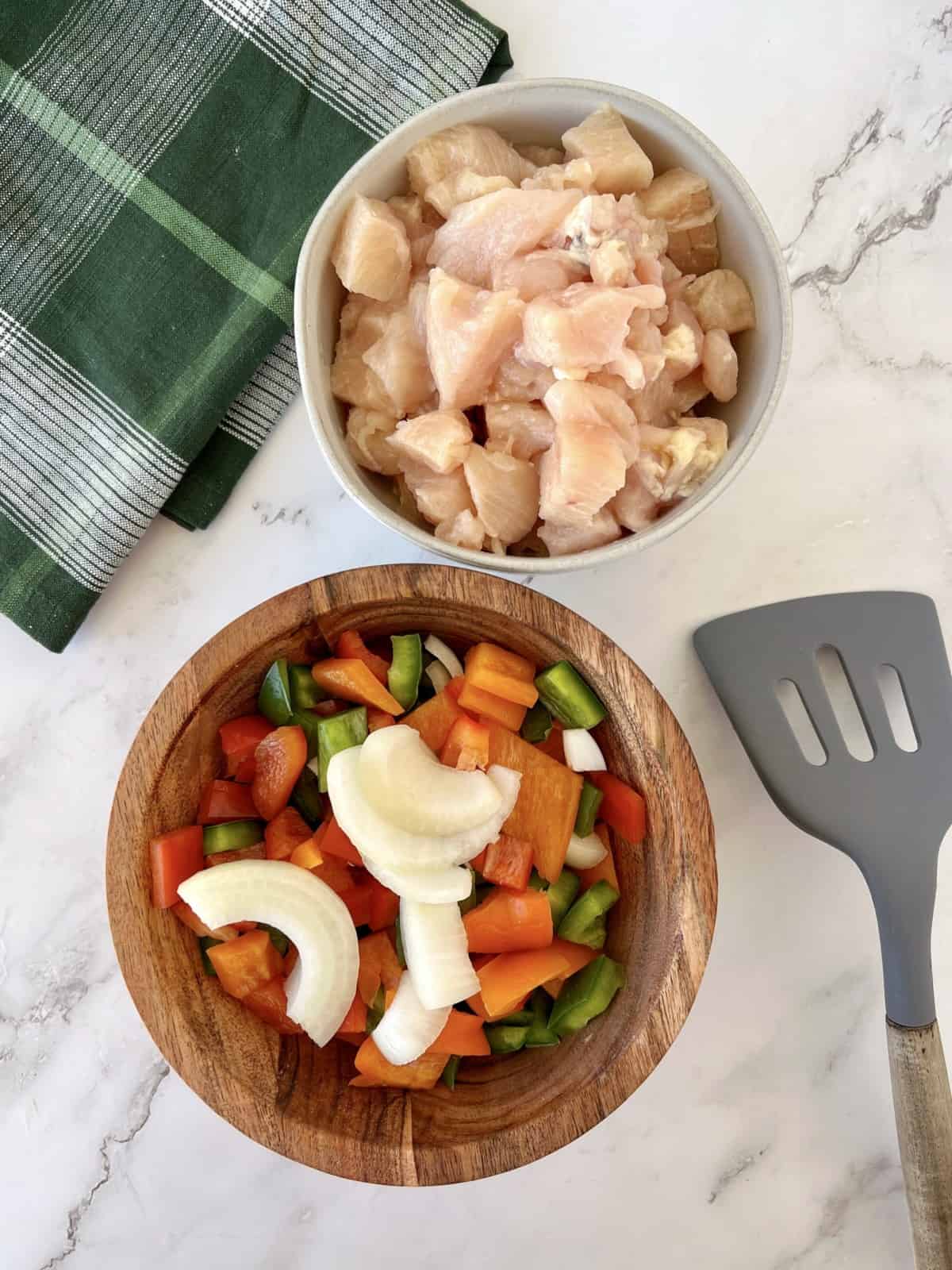 chopped veggies in a bowl and chopped chicken