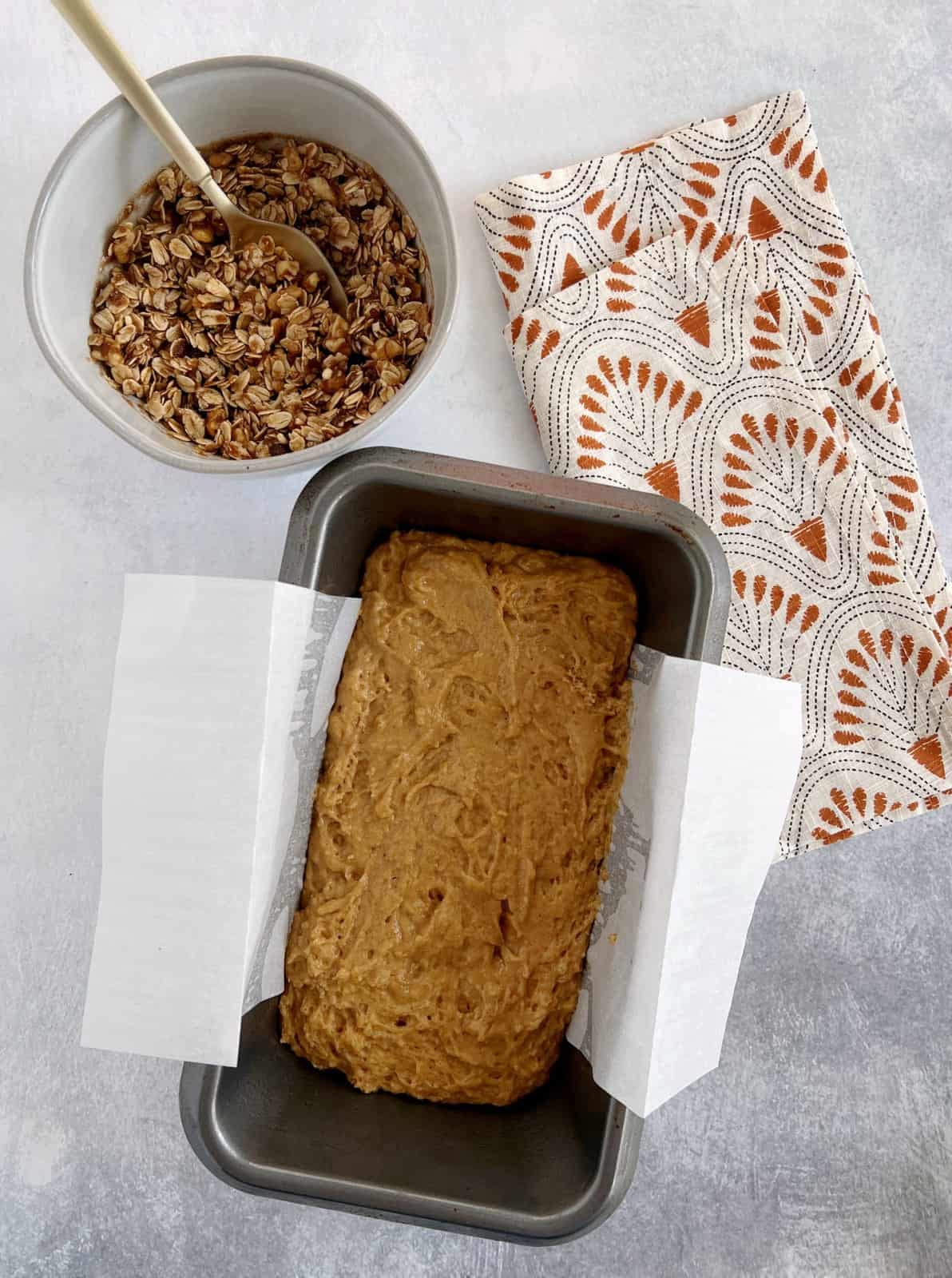 baking pan with mixture next to oats 