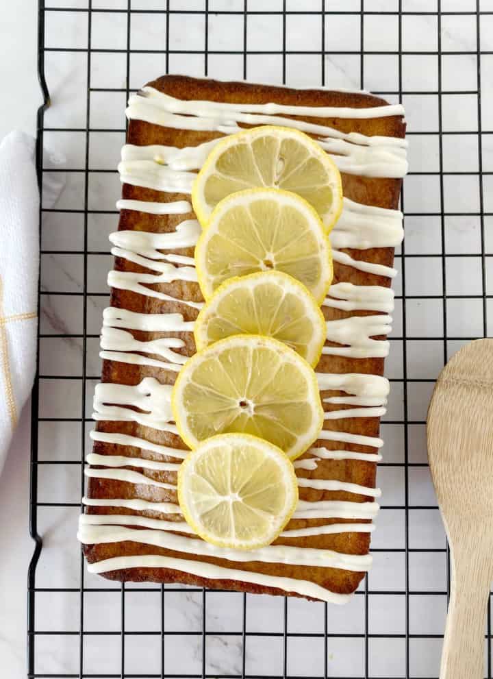 lemon cake with glaze and lemon slices on top