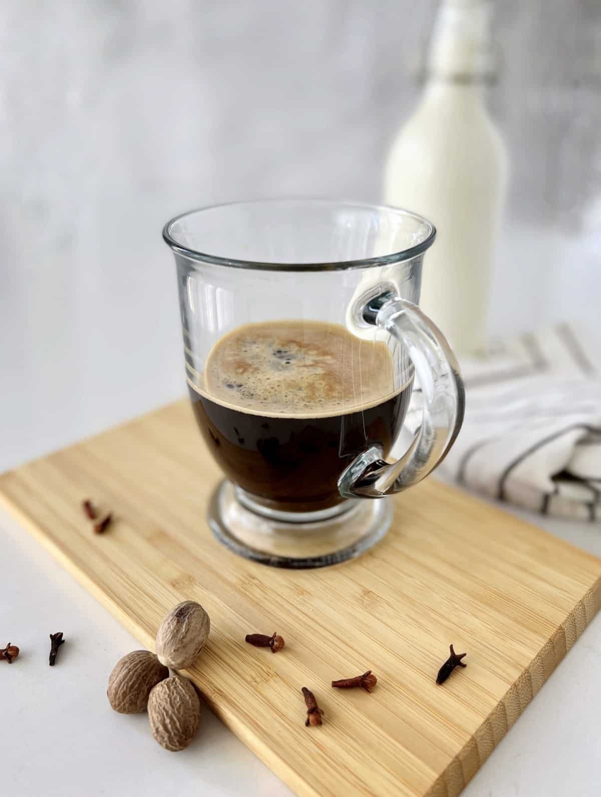 cup with espresso on a board 