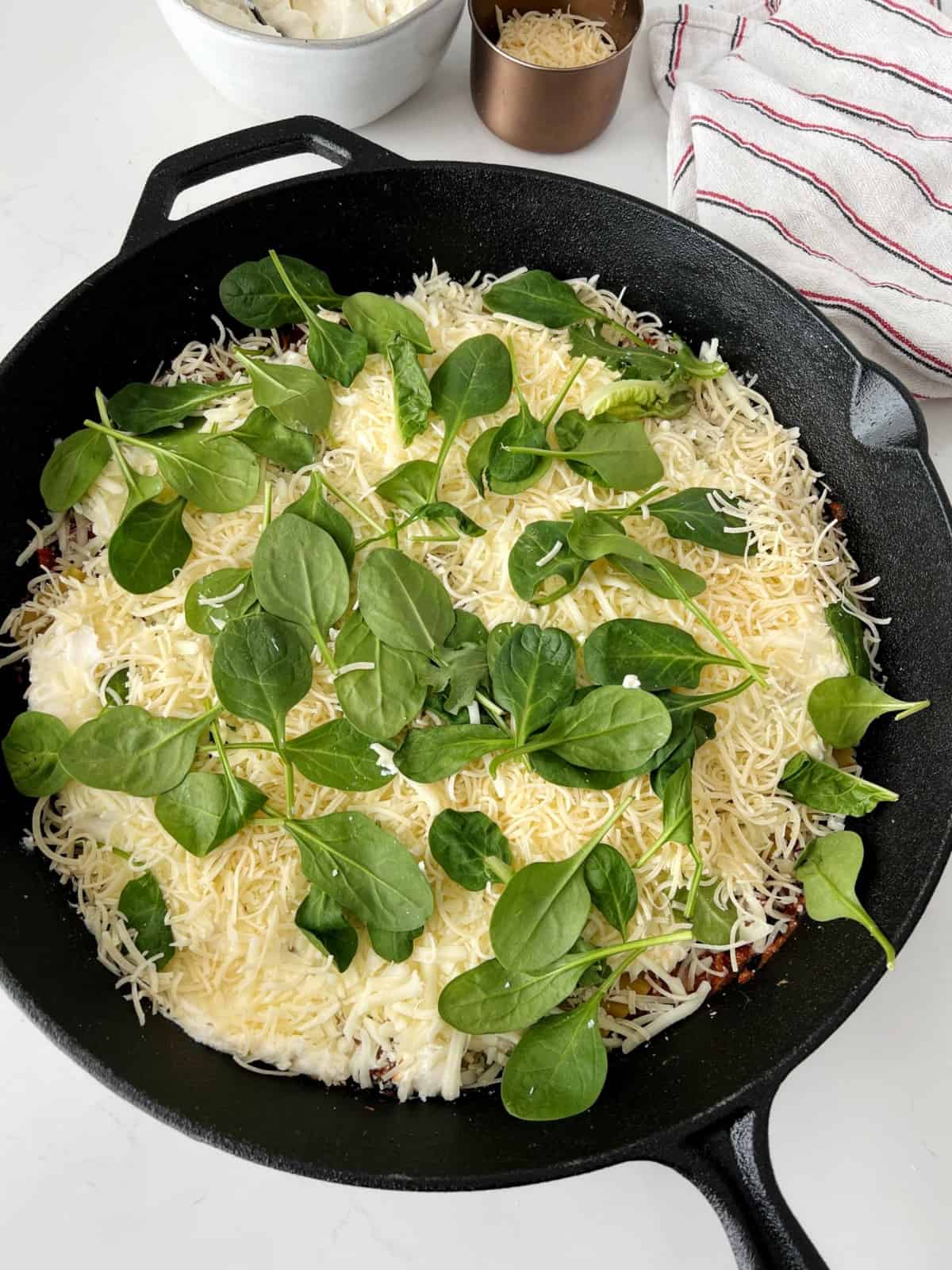 skillet with cheese and spinach 