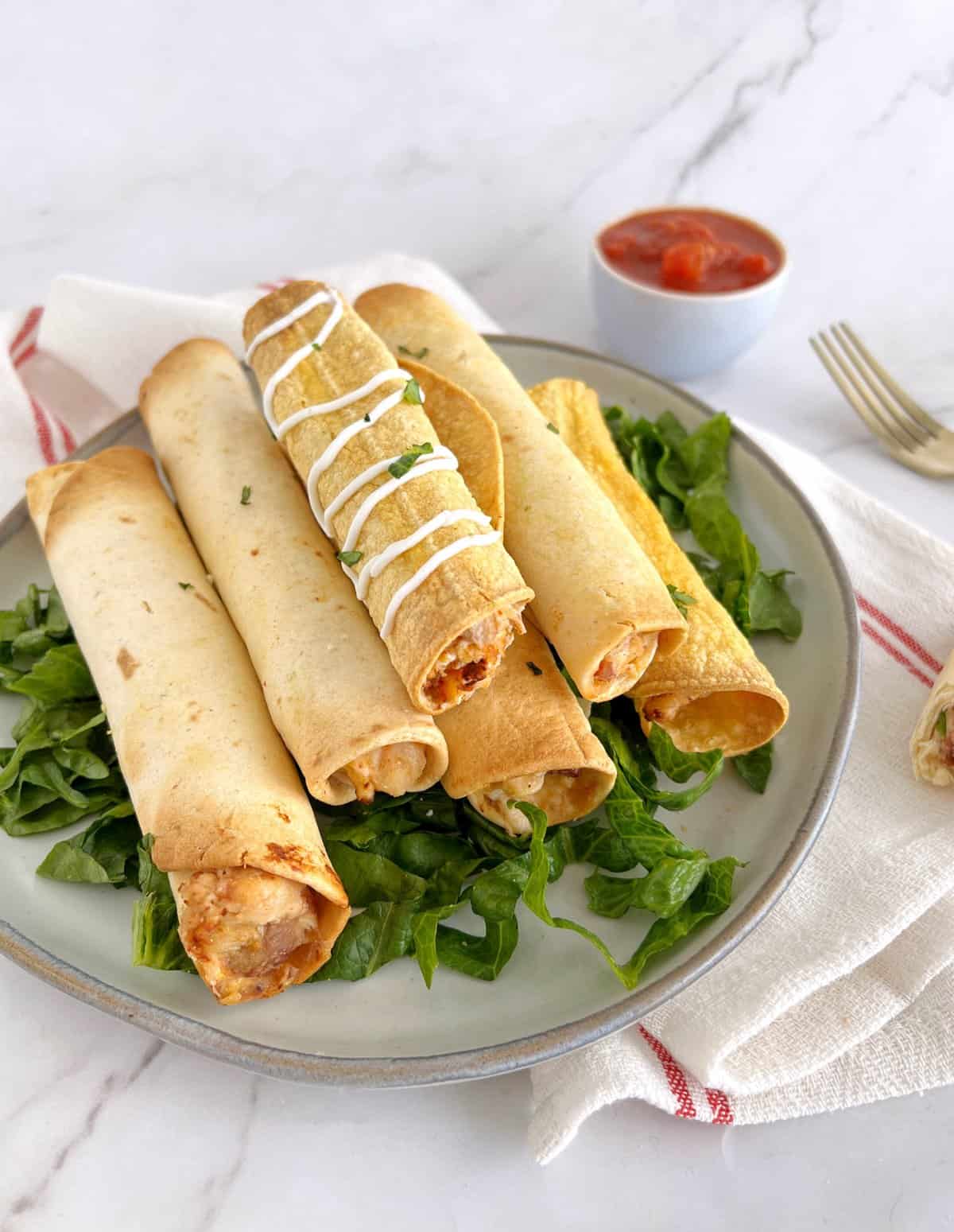 plate of taquitos on a plate 