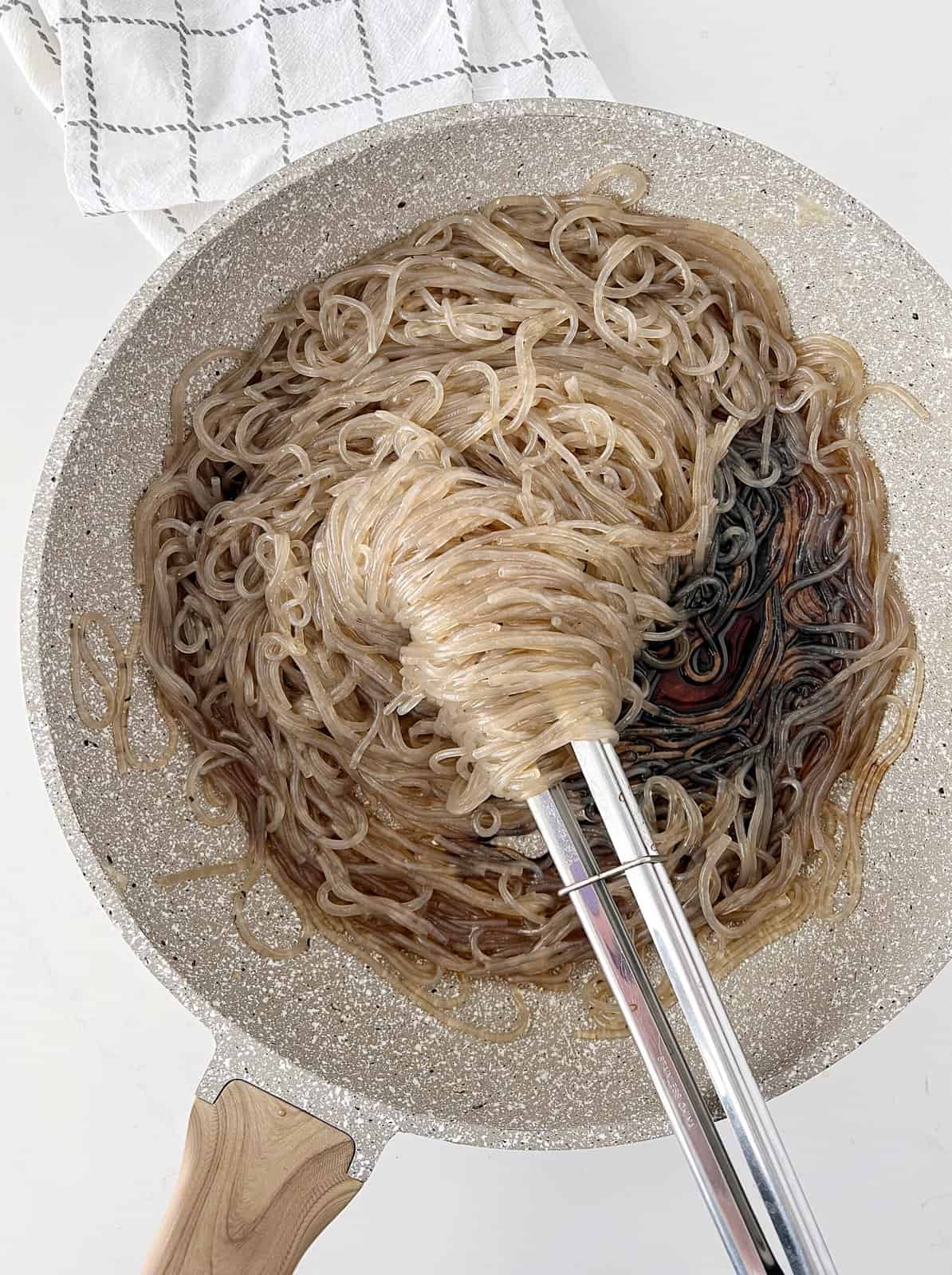 Pan of noodles with sauce 