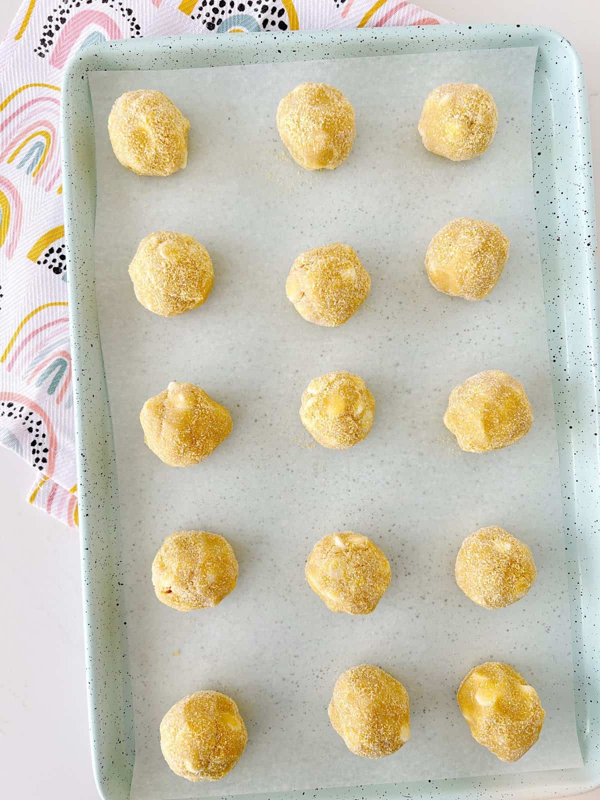 baking sheet with cookie dough balls 