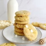 cornbread cookies stacked on a plate with milk
