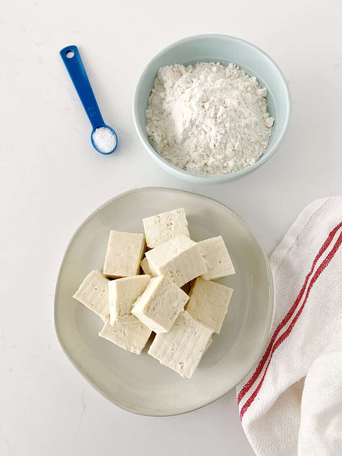 bowl of tofu and flour ready to be mixed 
