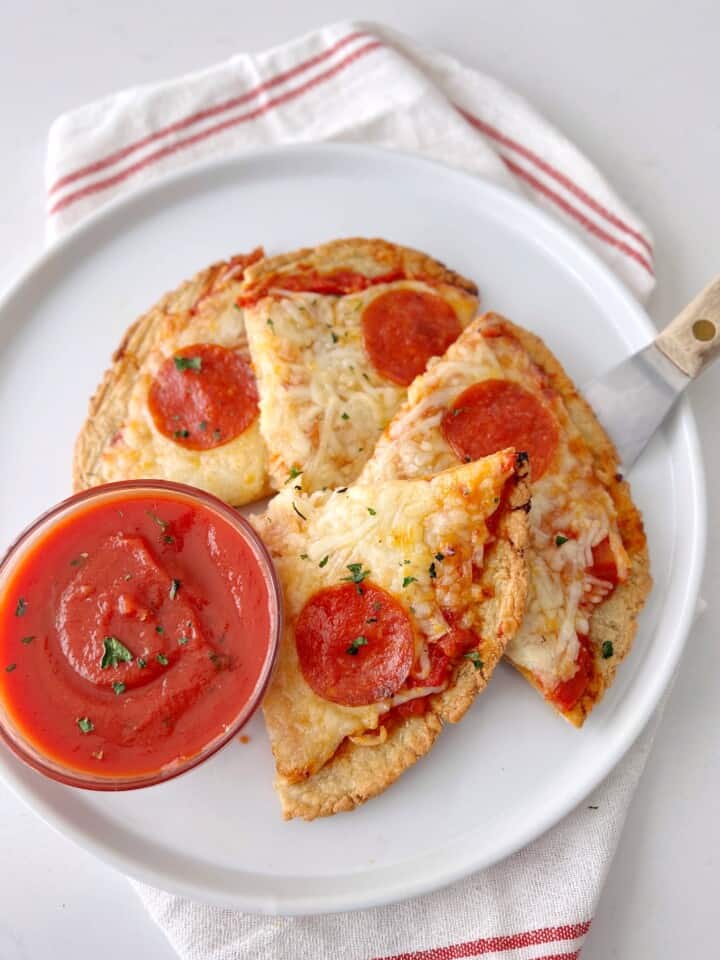 high protein piezza sliced on a late