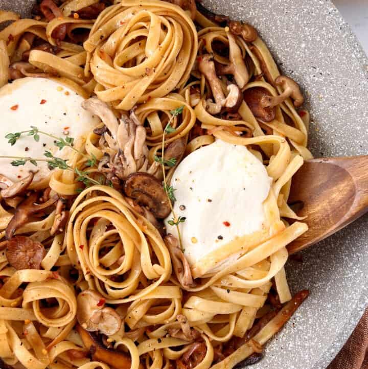burrata and pasta with a wooden spoon