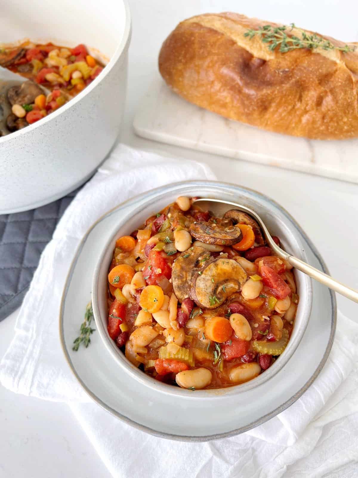 bowl of bean cassoulet with a spoon