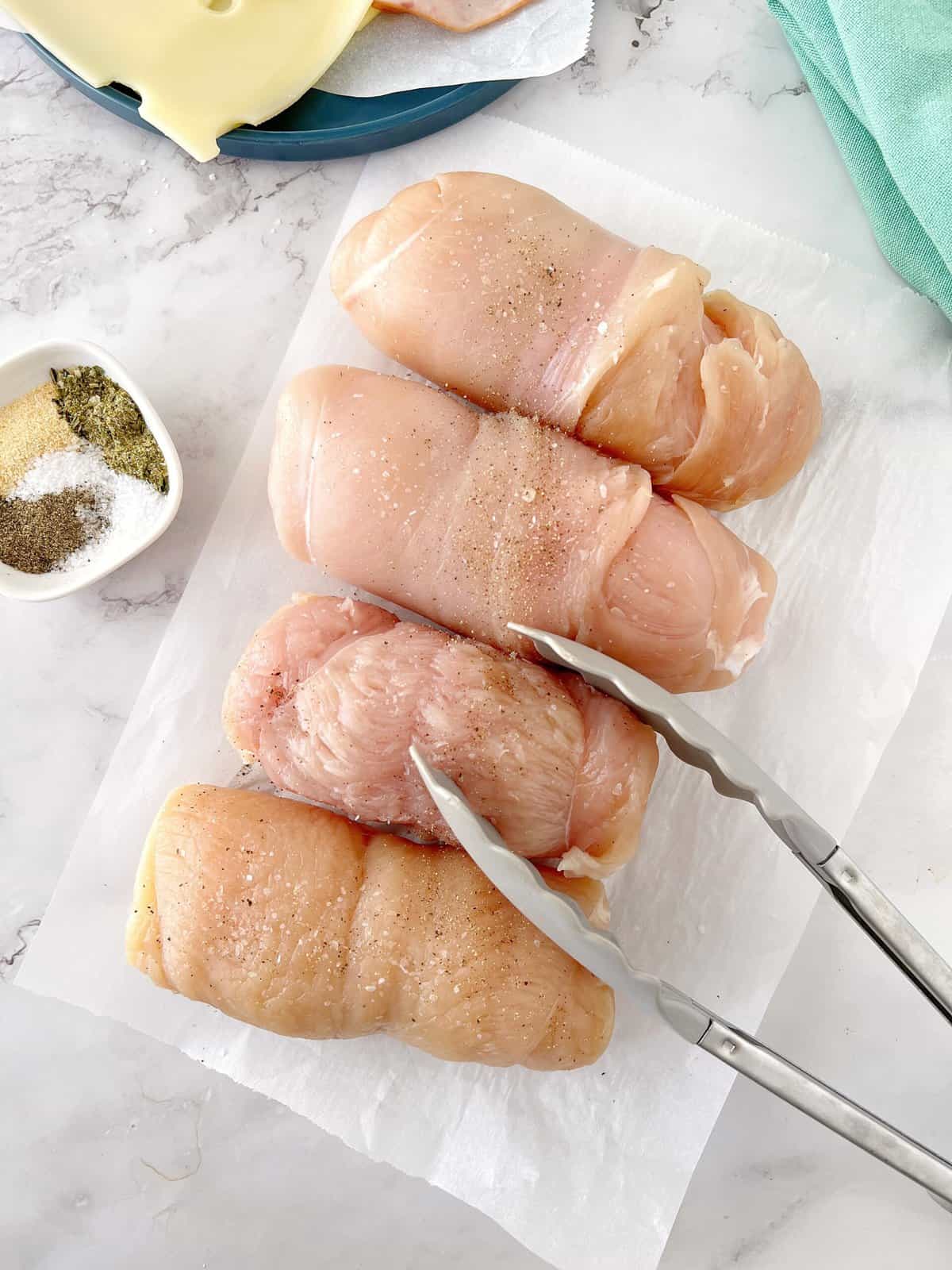 rolled raw chicken breasts ready for refrigerator 