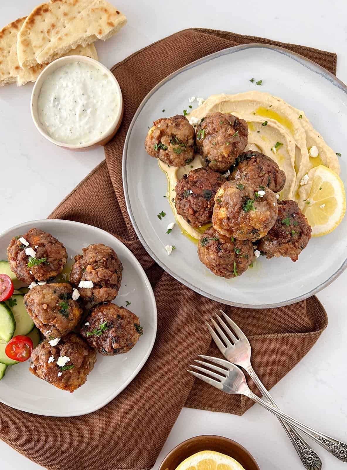 plates of meatballs with a brown napkin 