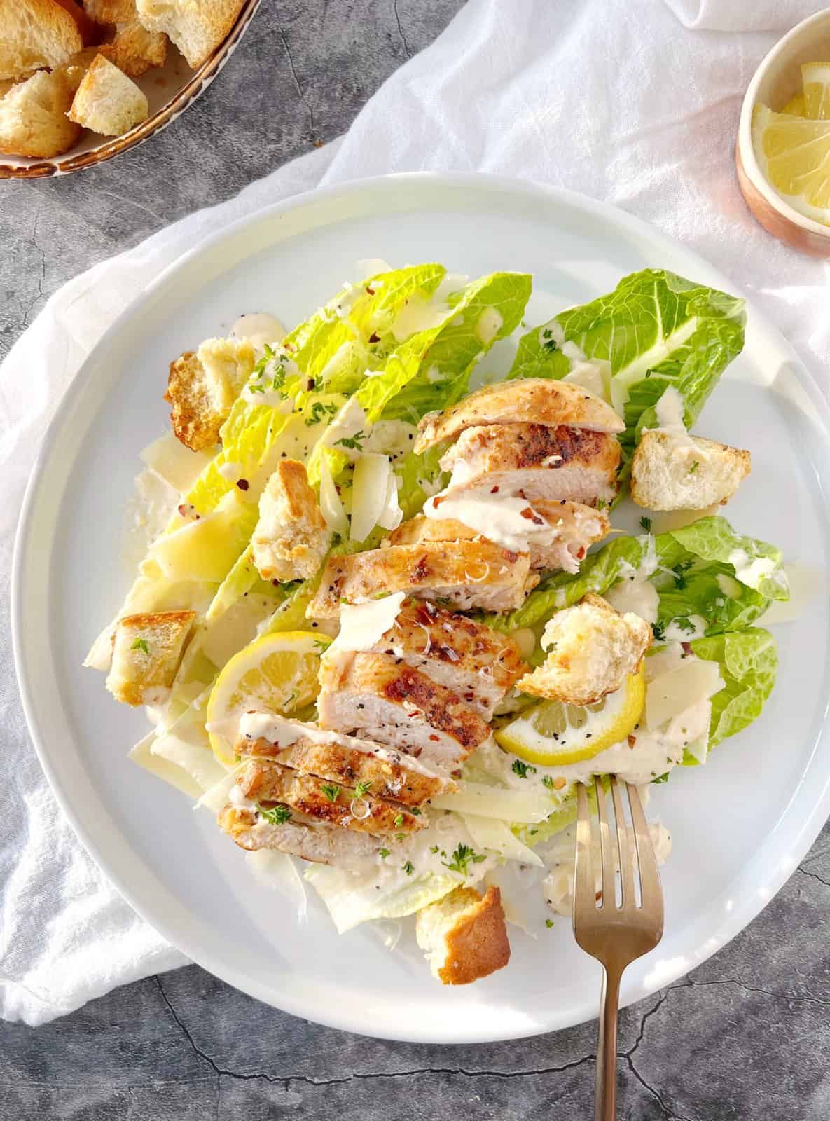caesar salad with chicken on a plate 