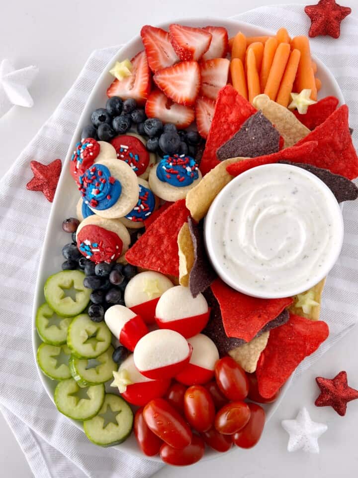 festive snacks including cheese fruit cookies and cucumbers