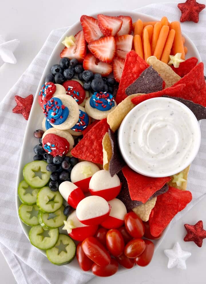 festive snacks including cheese fruit cookies and cucumbers