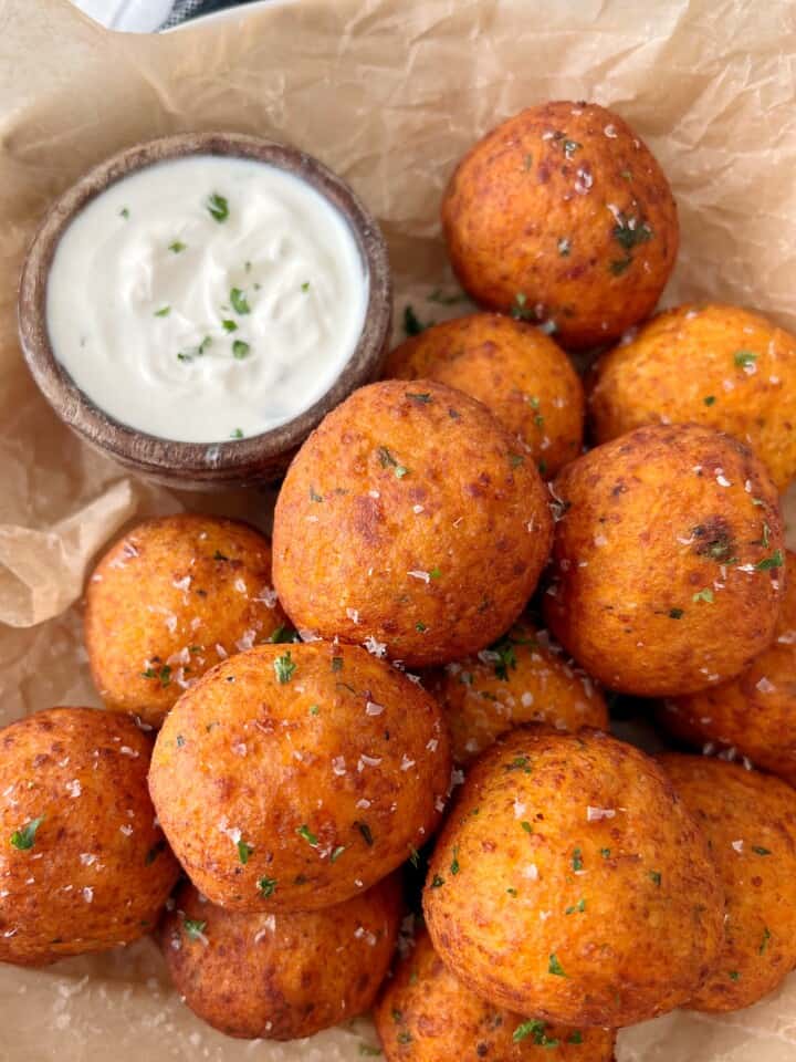 sweet potato balls next to bowl of ranch dressing